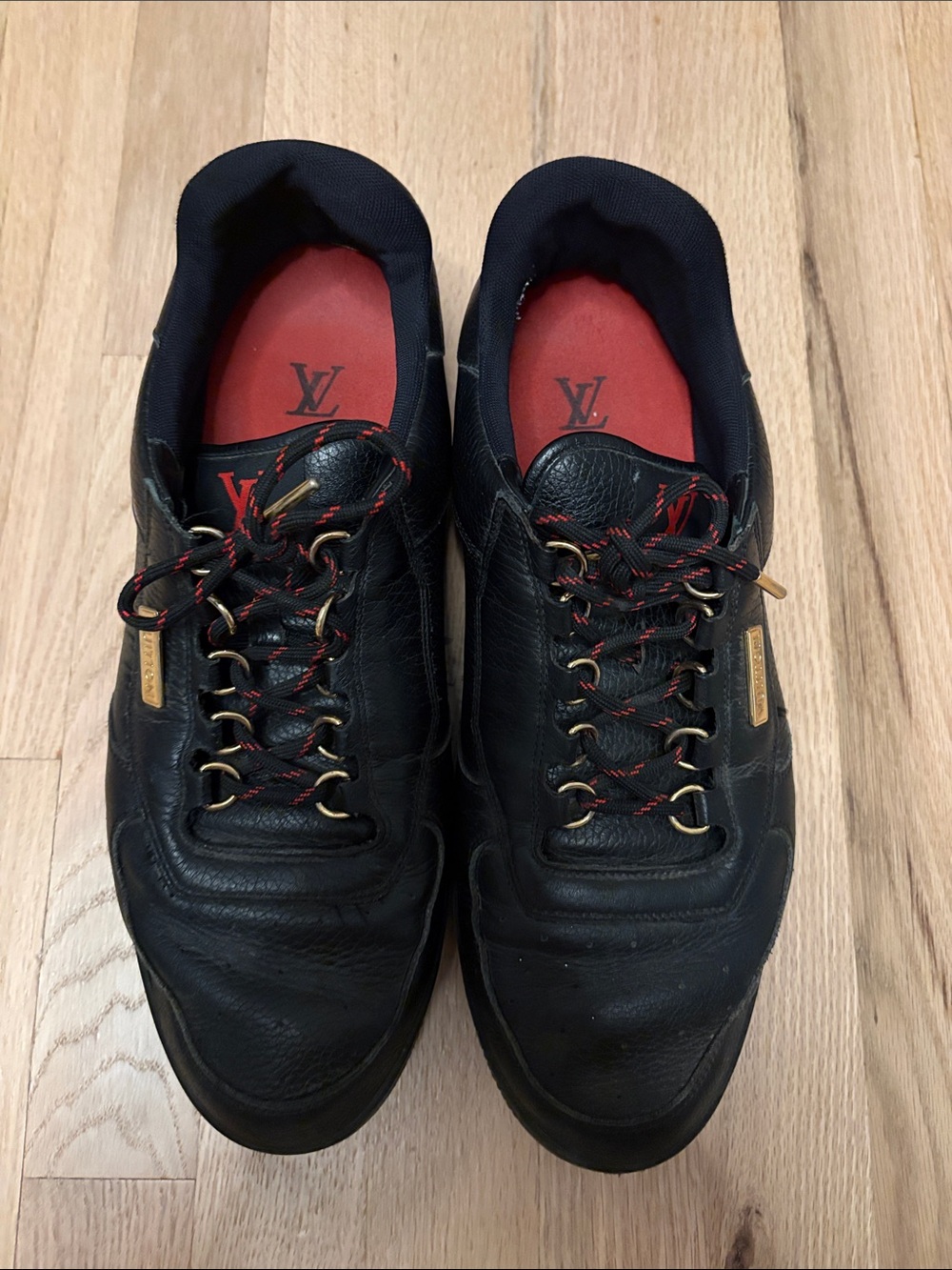 Louis Vuitton Black Leather Men's Sneakers with Red Insoles and Gold Accents